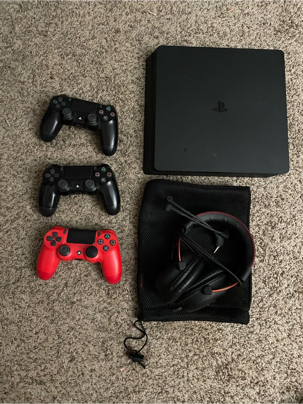 Sony PlayStation Slim Console with Black and Red DualShock Controllers